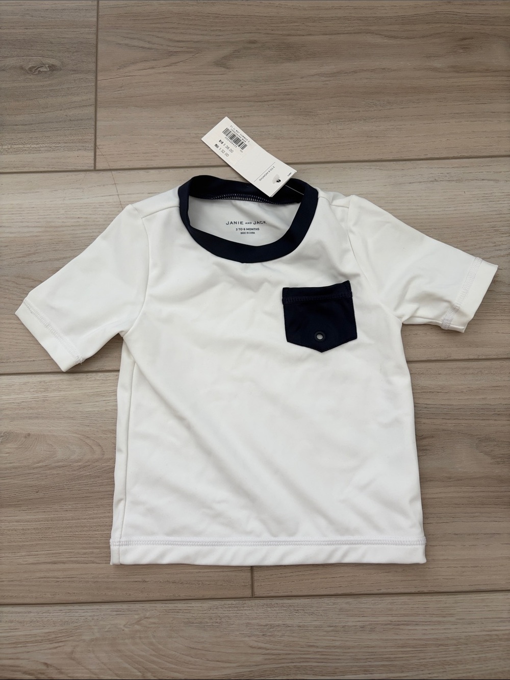 Janie and Jack White Rashguard with Navy Pocket and Trim